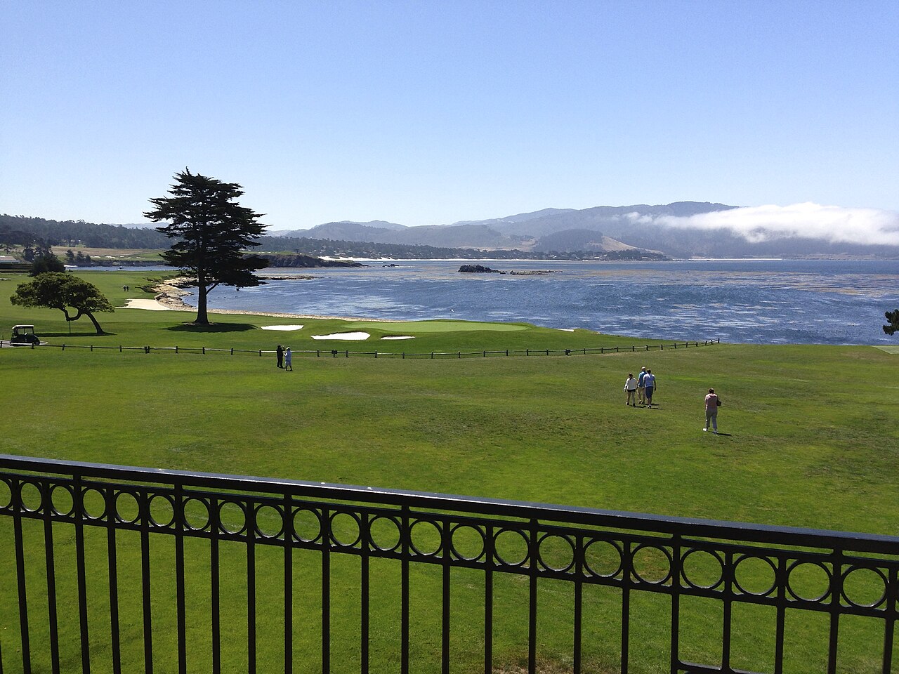 The 18th hole at Pebble Beach Golf Links, with Stillwater Cove and the Pacific Ocean behind the green
