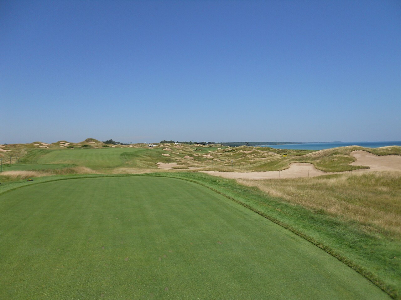 The 11th fairway of the Straits Course at Whistling Straits, with dunes, bunkers and Lake Michigan beyond, in Kohler, Wisconsin