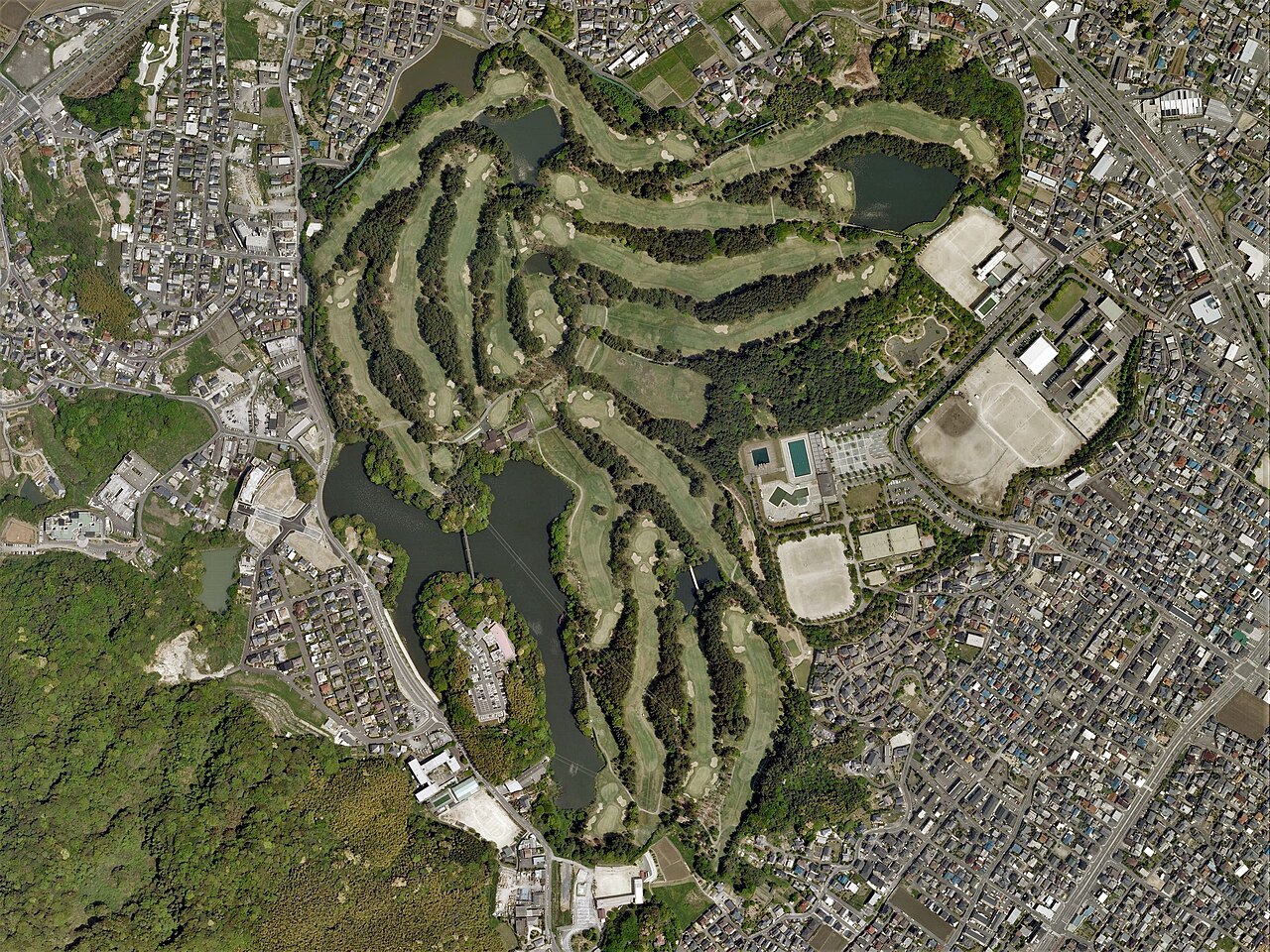 Aerial view of Kokura Country Club in Kitakyushu, Japan, showing full hole layouts like the ones golf GPS watches carry in their course maps
